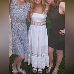 white dress with lace cut outs Rehearsal dinner or engagement photo bridal dress